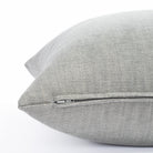 a soft light grey pillow : close up zipper view 