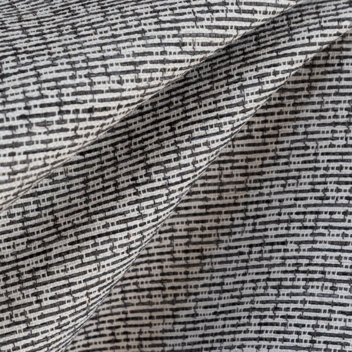 Renton Pavement, a black, grey and white textured upholstery fabric from Tonic Living