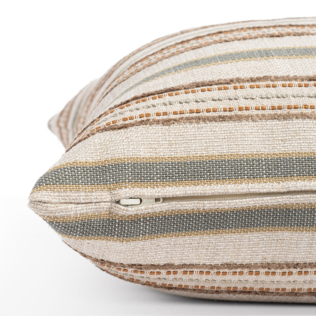 an earth toned multi-striped throw pillow : close up zipper view