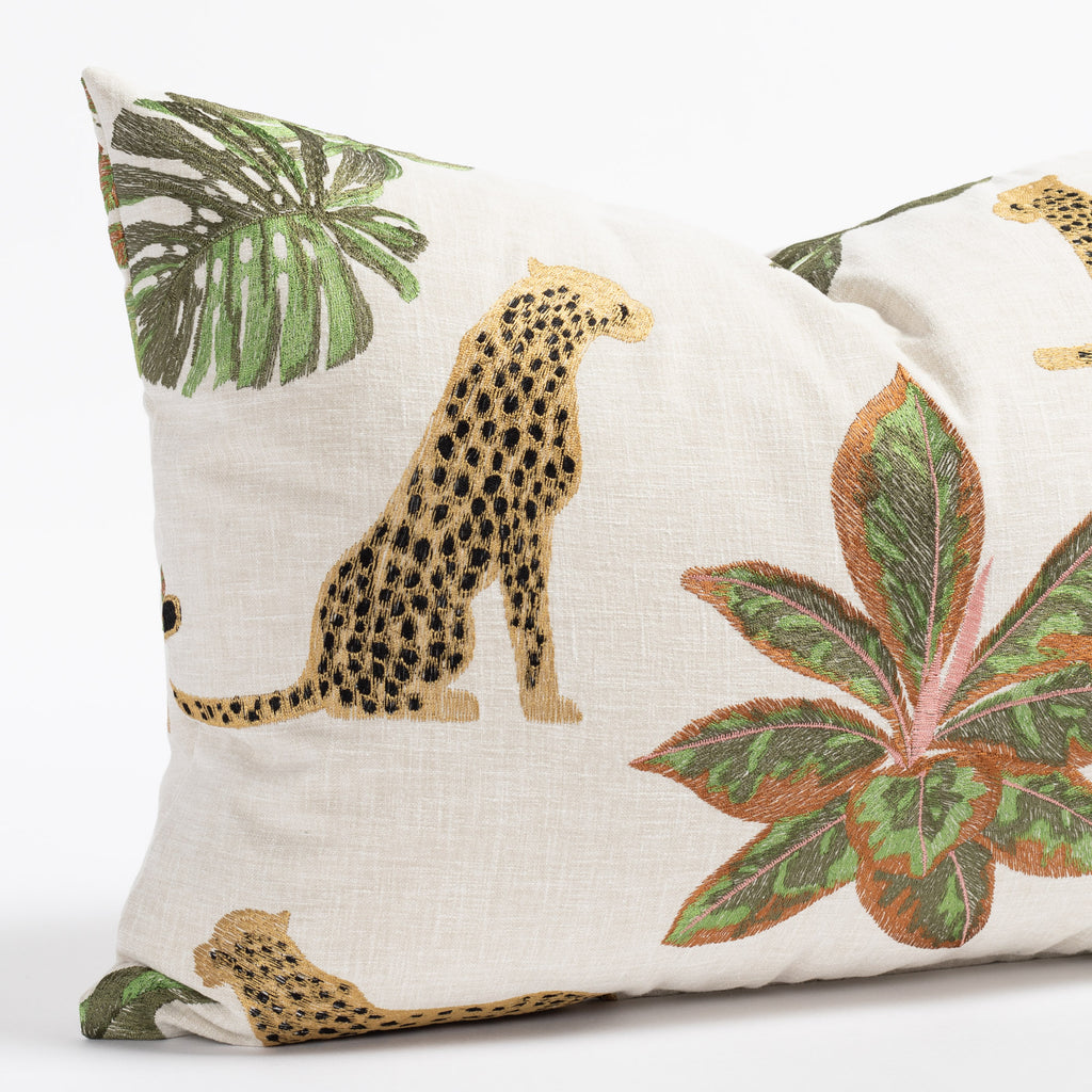 an embroidered lumbar throw pillow with embroidered cheetahs and lush greenery