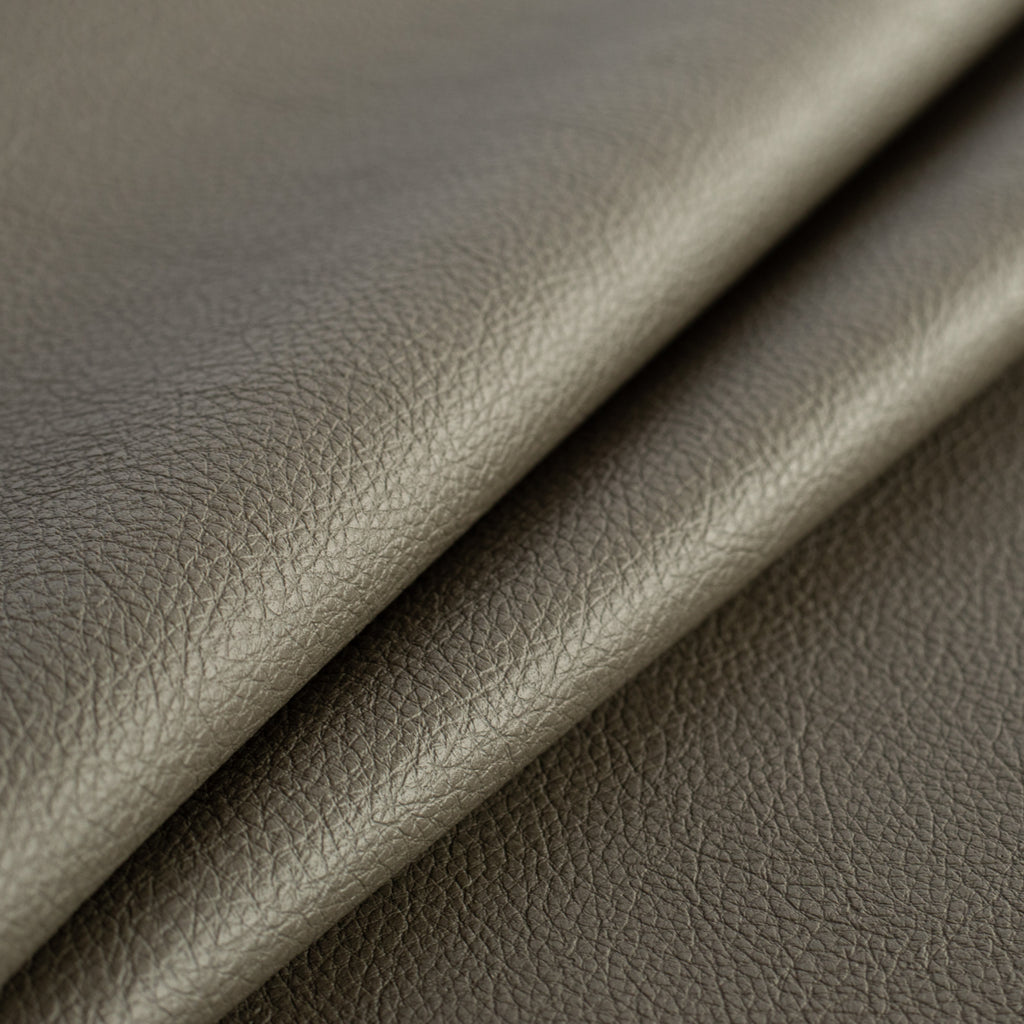 a charcoal grey green performance vinyl upholstery fabric : close up view