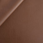 a deep brown vinyl faux leather performance upholstery fabric from tonic living