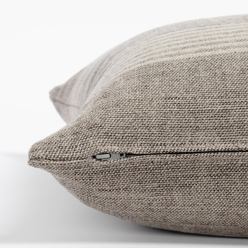 Stockton Stripe Graphite, a linen throw pillow, in shades of natural tan and faded black from Tonic Living : zipper detail view