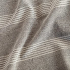 Stockton Graphite, a grey and cream wide set stripe pure linen upholstery fabric from Tonic Living