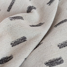 Stratus Fabric Cream, a cream upholstery fabric with an abstract black brush stroke pattern : view 3