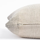 a smokey blue and sandy grey ombré stripe throw pillow : close up zipper view