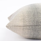 a blue and sandy grey ombré stripe throw pillow : close up side view