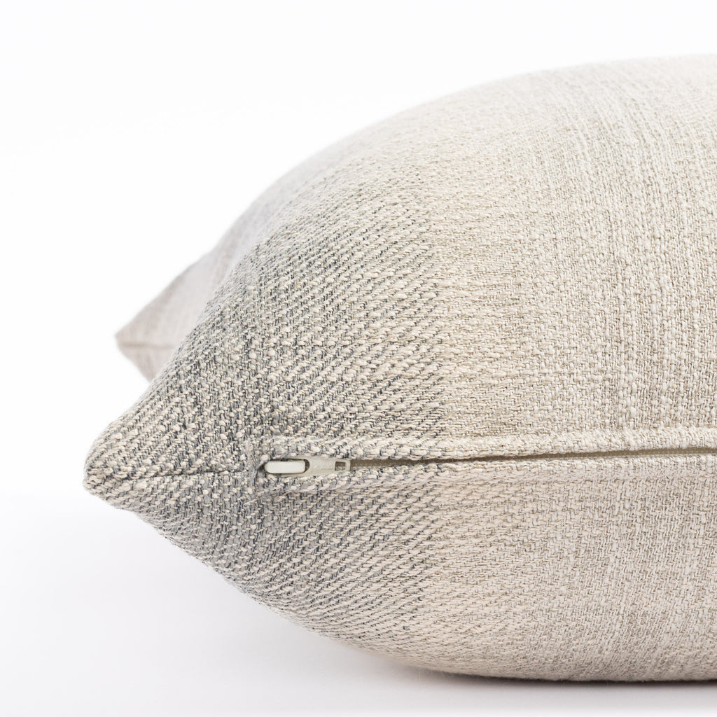 a smokey blue and sandy grey ombré stripe throw pillow : close up zipper view