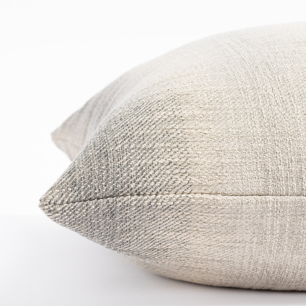 a smokey blue and sandy grey ombré stripe throw pillow : close up side view