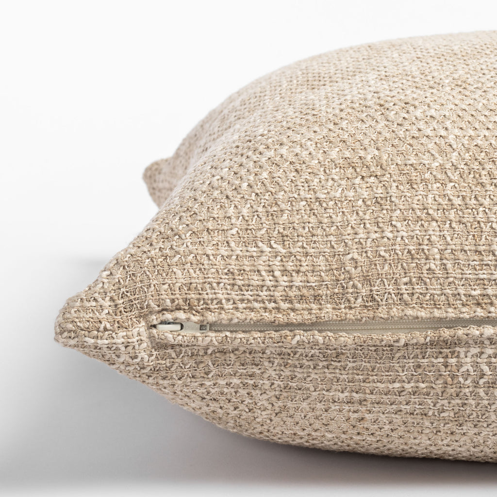 Taryn 22" x 22" Natural, a beige textured pillow : close up of zipper