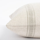  a cream and watery blue green stripe throw pillow : close up side view
