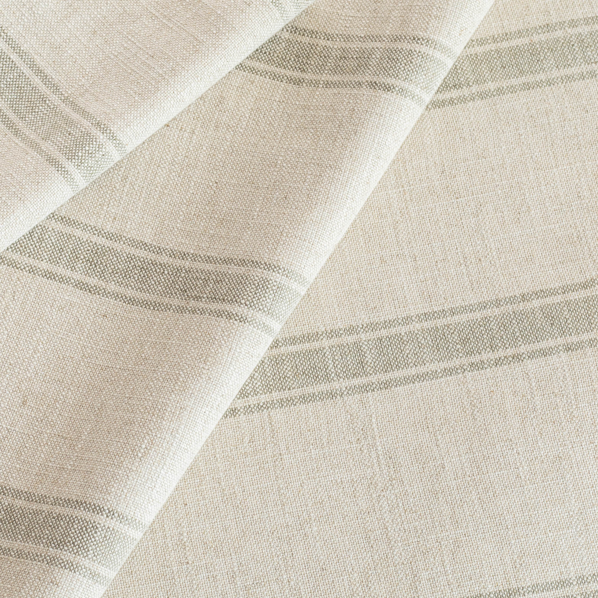a watery blue and cream wide ticking stripe designer Tonic Living upholstery fabric