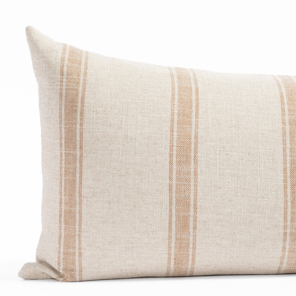 a faded rust and cream wide vertical ticking stripe lumbar pillow : close up view