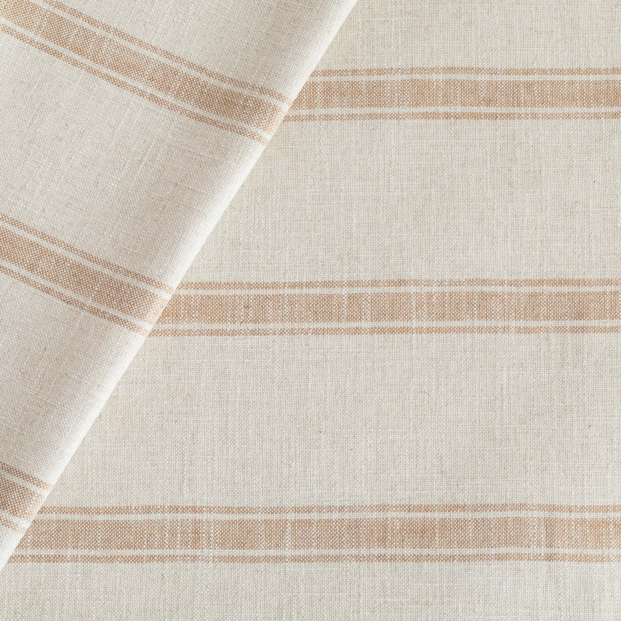 a faded rust and oatmeal cream striped upholstery fabric from Tonic Living 