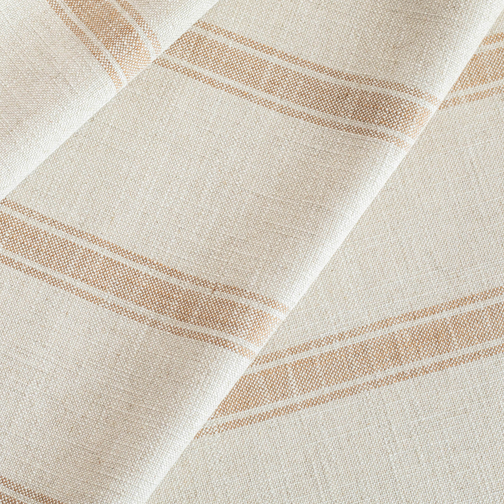 a faded rust and cream wide ticking stripe designer upholstery fabric