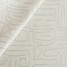 an off-white and light grey abstract line pattern upholstery fabric