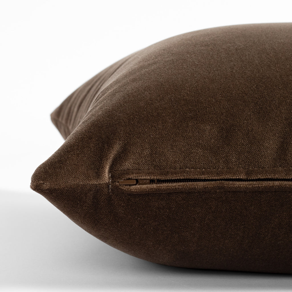 a chocolate brown velvet throw pillow : zipper detail