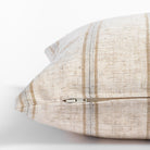 Yarmouth Stripe Sandstone, a beige lumbar pillow with golden sand and grey vertical stripes : close up zipper view