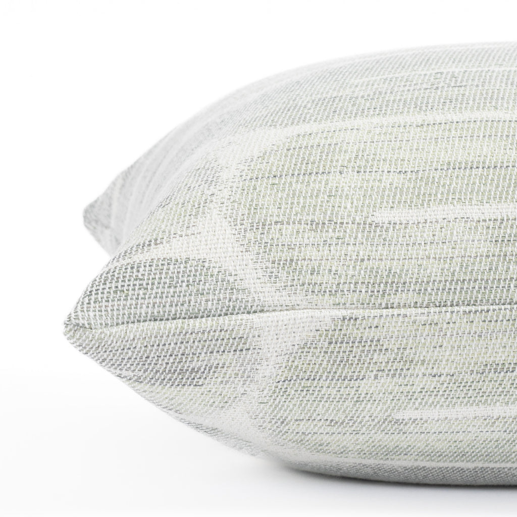 a watery blue green and white painterly swirl graphic pattern bolster pillow : close up side view