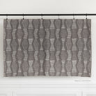 Zipporah Nickel, a dark gray upholstery fabric with cream dot dash motifs : one yard cut